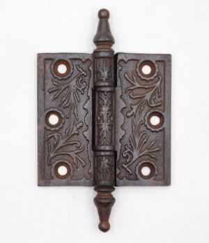 Victorian cast iron butt door hinge with steeple tips, three knuckles, and a template hole pattern.