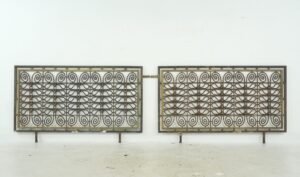 Pair of decorative wrought iron and brass grills with scrollwork panels and a rectangular frame, shown together as a matching pair.