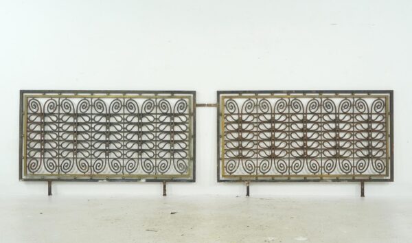 Pair of decorative wrought iron and brass grills with scrollwork panels and a rectangular frame, shown together as a matching pair.