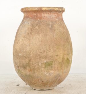 Large terra cotta olive jar with an ochre glaze, shown full length and centered, with a rounded body, flared rim, and visible age wear and chips.
