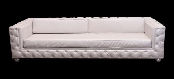 Mid century white vinyl tuxedo sofa with diamond tufted detailing and chrome ball feet.