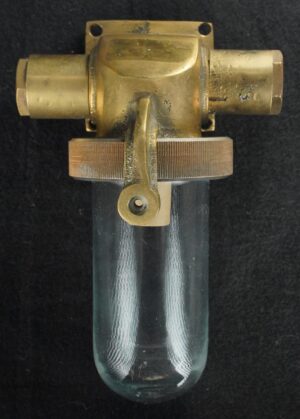 Vintage nautical wall light with an antique brass fitter and clear glass tube shade shown from the front.