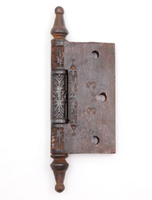 Victorian cast iron butt door hinge with steeple tips, three knuckles, and decorative embossing, shown in a single front view.