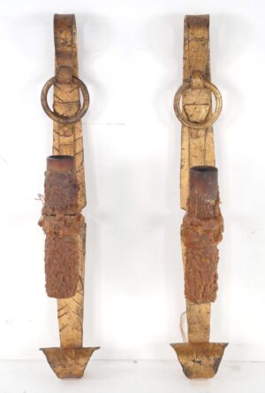 Pair of Spanish Revival wrought iron wall sconces with scrollwork, textured candle sleeves, and a gilt finish shown side by side.