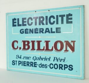 Vintage French wood commercial sign painted blue, white, and red, with large text for “Électricité Générale,” C. Billon, and a street address, shown with surface wear and a slightly angled view.
