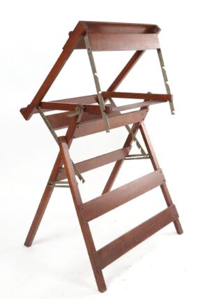 Collapsible oak easel with a dark wood tone and metal brackets, shown open in a three-legged side view.