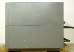 Gray steel flat filing cabinet shown front-on with two large drawer sections and folding shelves extended on the right, displaying surface wear and age-related scuffs.