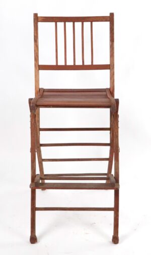 Antique wooden directors chair shown folded open, with a slatted seat, vertical back spindles, and visible age wear on the dark wood tone frame.