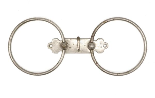 Double towel ring with a nickel finish and visible tarnish, showing a central mounting plate with two circular rings.