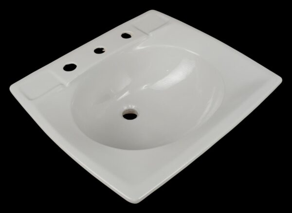 White ceramic wall sink with an oval basin and three faucet holes shown in a top-down view.