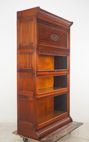 Victorian-style barrister bookcase with a writing bureau and three glass-front storage compartments, shown in a three-quarter view with the bureau panel closed.