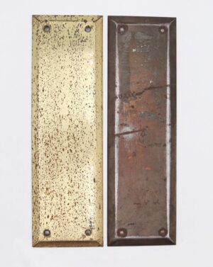 Pair of vintage steel door push plates shown side by side, one in antique brass finish and one in polished brass finish, each with a beveled edge and four mounting holes.